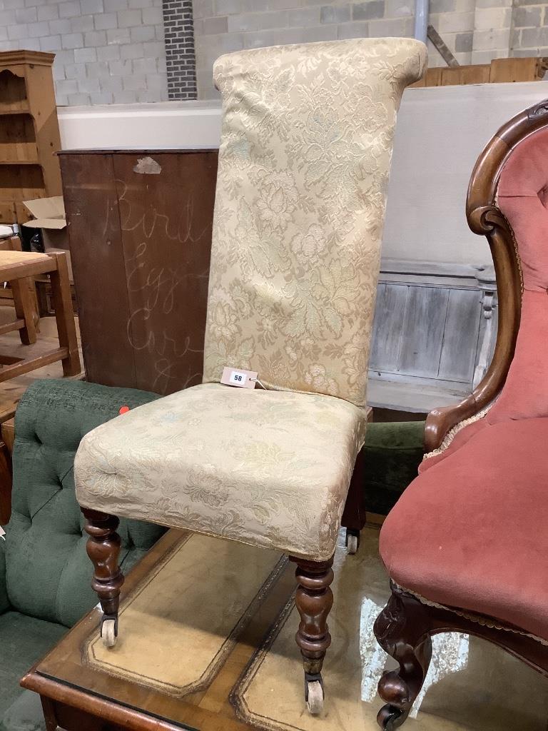 A Victorian mahogany framed prie dieu chair, upholstered in cream brocade